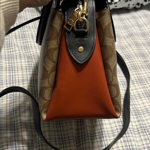 Coach Signature Brown and Black with a burnt orange bottom and sides Satchel